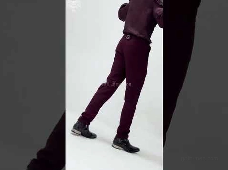 Back view of wine red gothic slim-fit pants showing tapered leg cut and burgundy-toned fabric texture