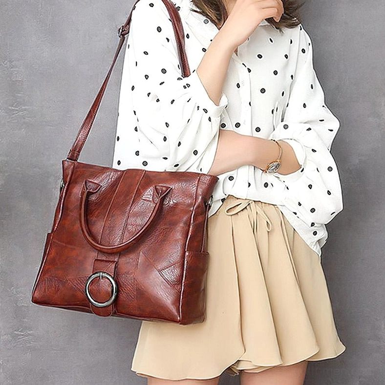 Woman wearing wine red gothic vintage tote as crossbody bag - side view casual polka dot styling