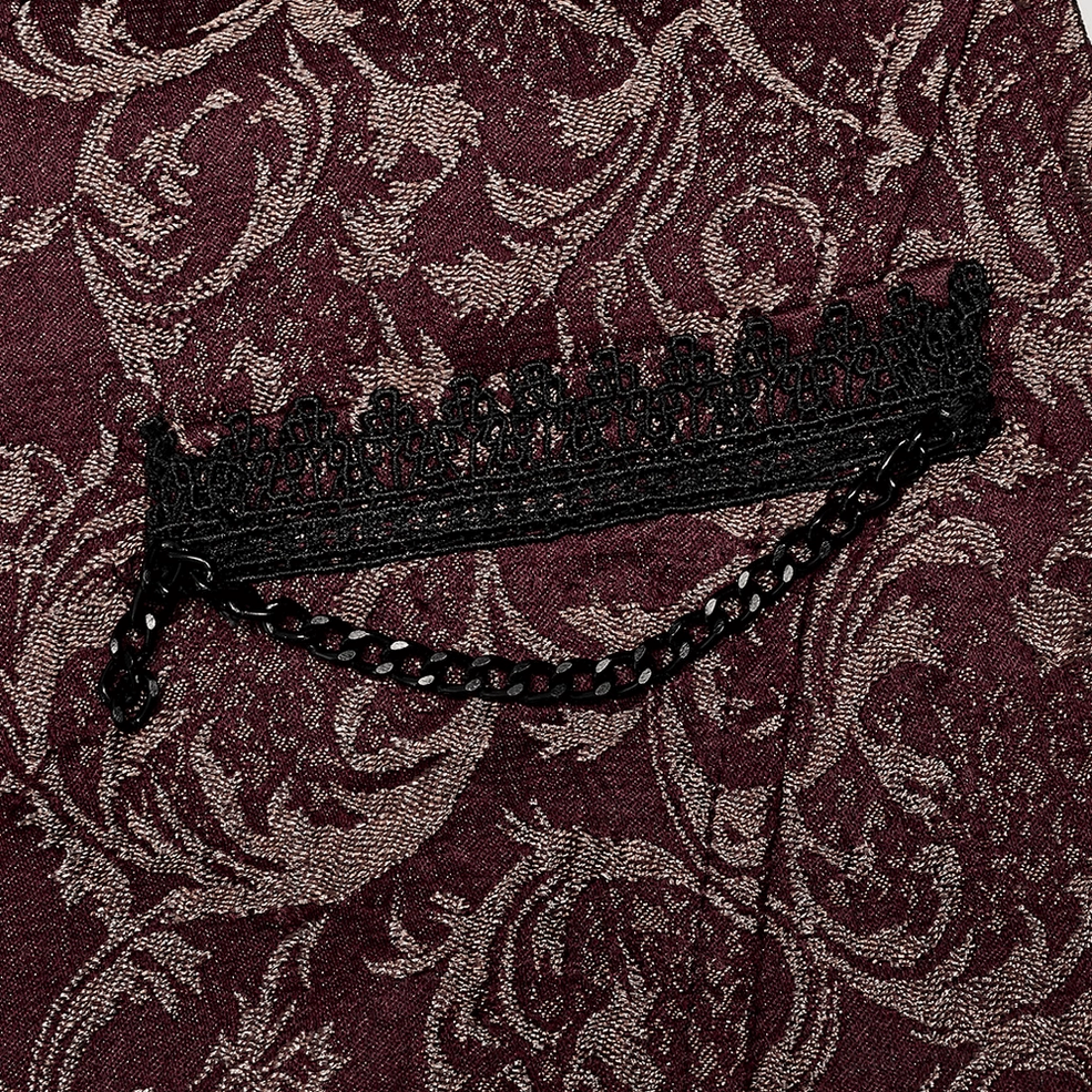 Detailed close-up of wine red jacquard waistcoat trim showing black lace trim, metal chain accent, and burgundy damask base fabric