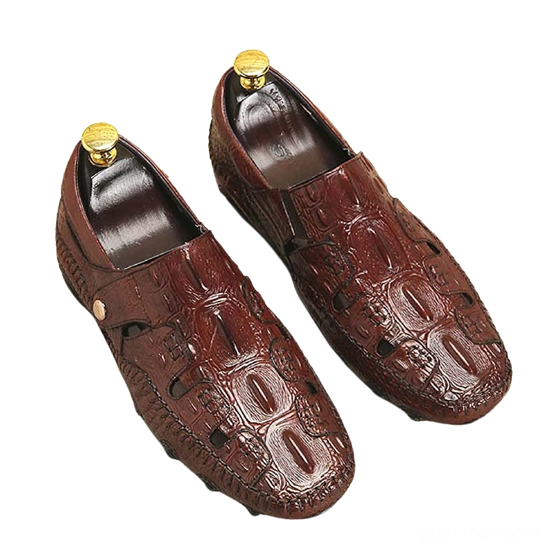 Overhead flat lay of wine red gothic loafers showing crocodile embossing texture, metal side button detail, and built-in shoe tree support