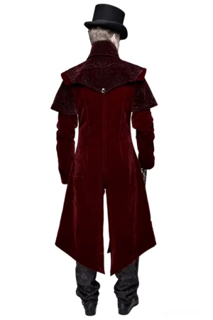 Rear view of wine red velvet gothic coat on male model showing elongated hemline and structured shoulder cape design