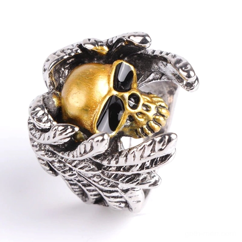 Top oblique view of winged skull ring revealing textured feather wraps and dimensional skull craftsmanship