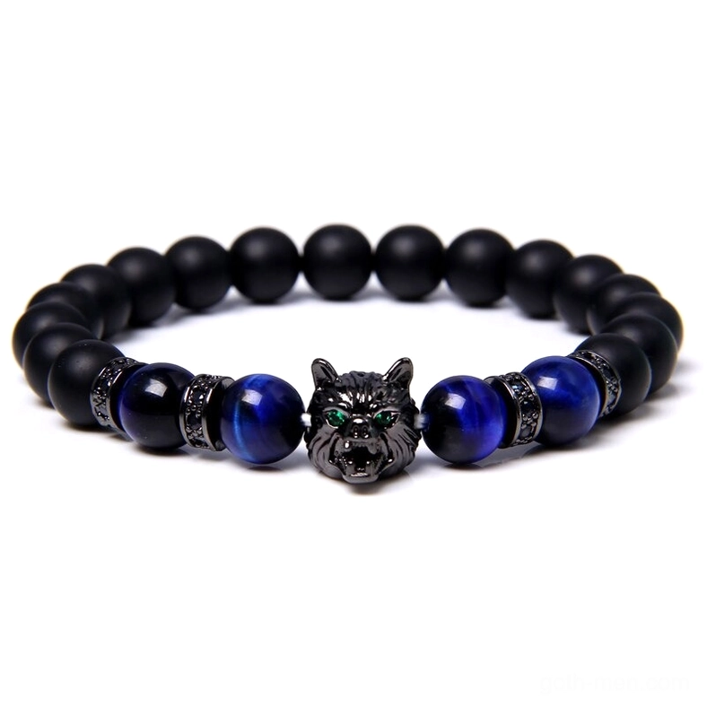 Wolf charm elastic bracelet featuring black onyx and blue tiger eye stones with metal spacers, gothic aesthetic detail shot