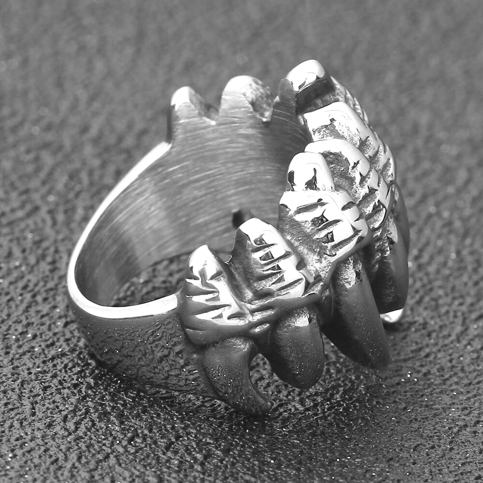 Three-quarter inner side view of wolf claw ring displaying raised claw decorations and brushed metal surface