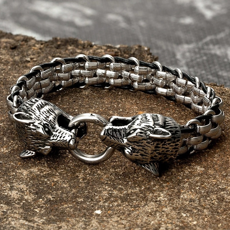 Brushed silver wolf head gothic bracelet engraved detail flat lay