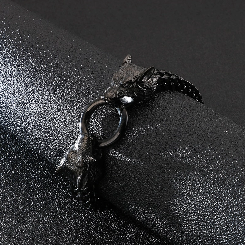 Stainless steel wolf head gothic bracelet artistic flat lay composition on textured background