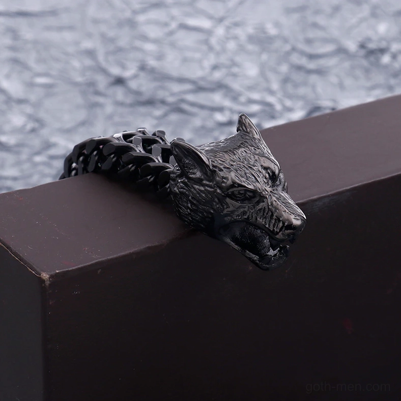 Multiple wolf head stainless steel gothic bracelets arranged showing different metal finishes