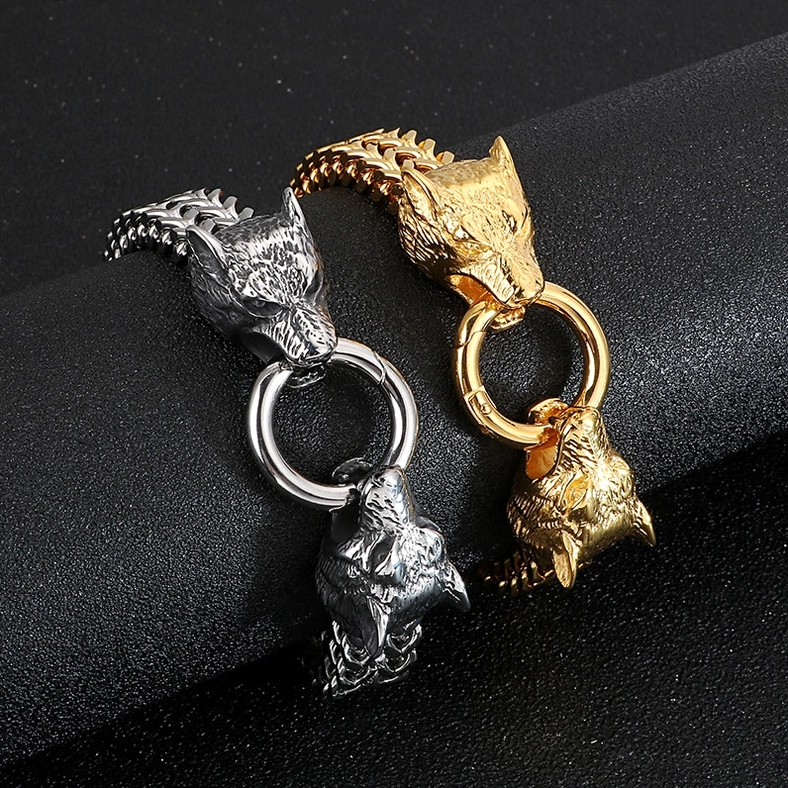 Three wolf head stainless steel gothic bracelets close-up showing intricate wolf head carving details