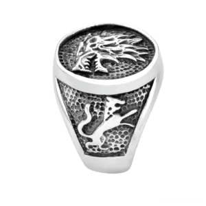 Antique wolf and lion relief heraldic signet ring top down view distressed finish