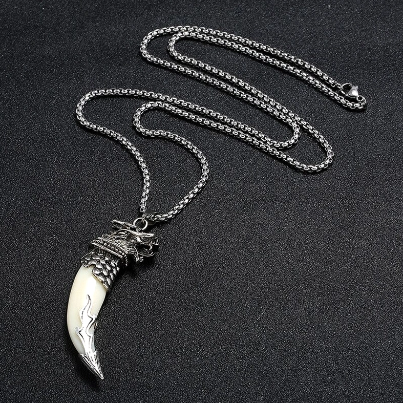 gothic wolf tooth pendant necklace close-up side view wolf head metal cap leather background detail