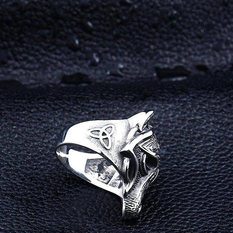 Wolf ring gothic jewelry, stainless steel construction, detailed wolf face sculpture, dramatic dark styling photography