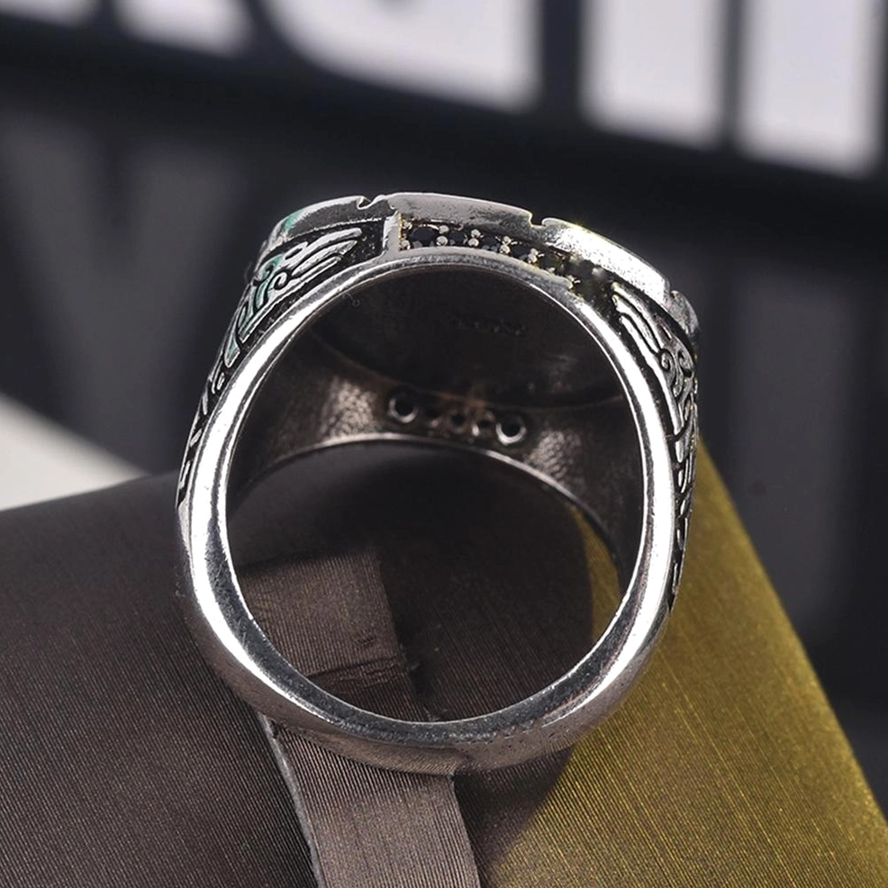 Inside bottom view of gothic wolf ring showing polished metal surface and tribal engravings on inner band
