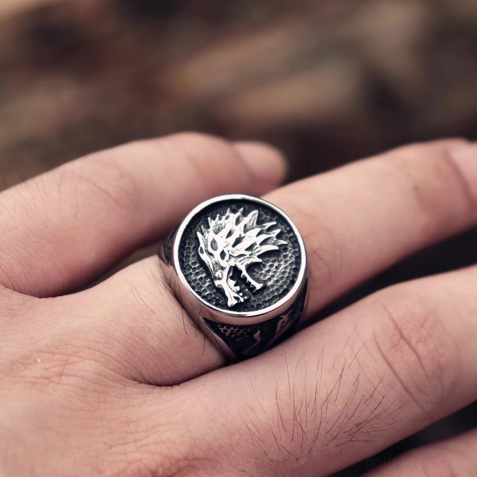 Wolf head finger ring dark finish worn on male hand close up gothic style